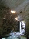 The door connecting the shop and the cellar, walled up with slack masonry made of reused material. 